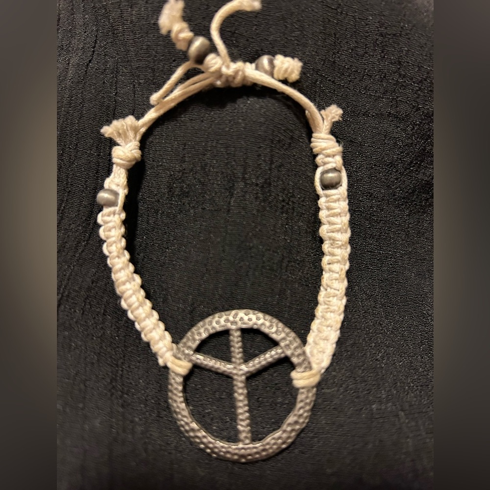 *Adjustable peace sign bracelet.